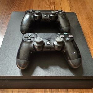 Sony Black PS4 Slim with Two Black DualShock 4 Controllers and 7 Games